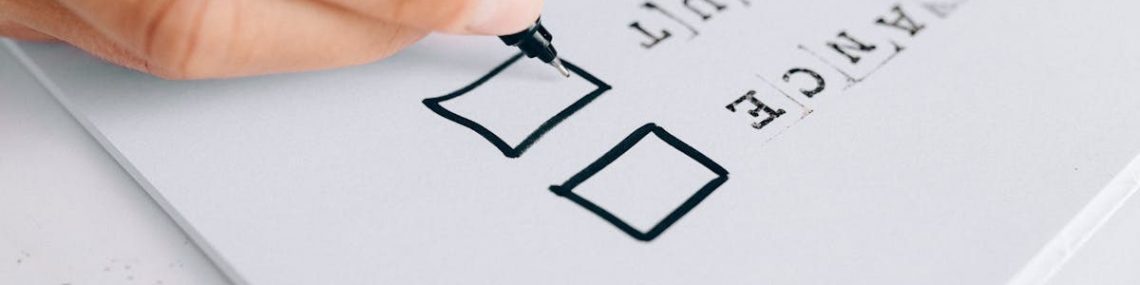 A hand drawing checkboxes on a checklist, themed around balance and burnout.